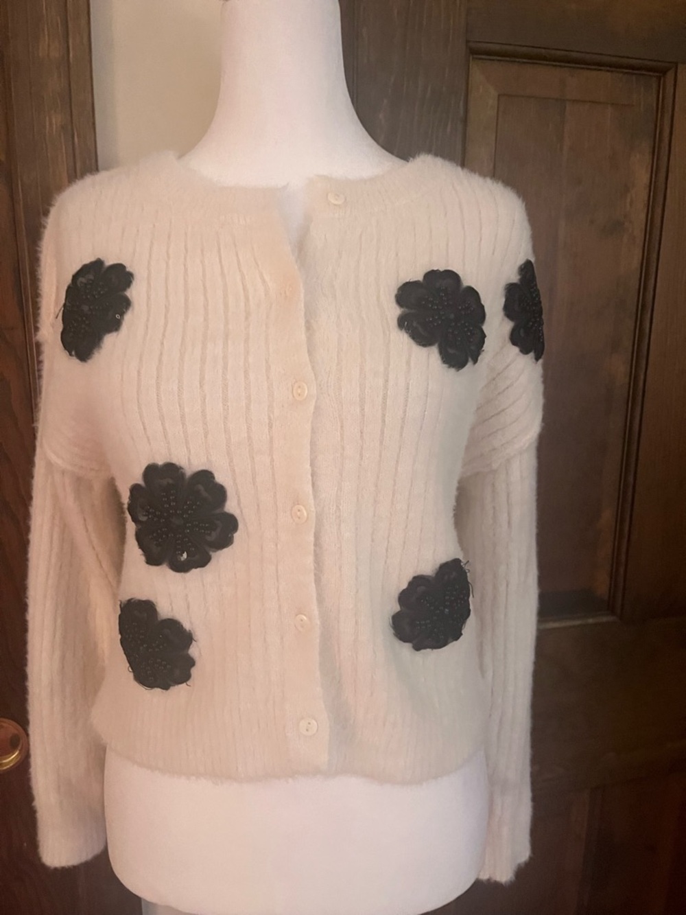 Francesca's Collections Cream Cardigan with Black Floral Appliqués